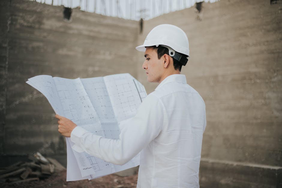 Contractor reviewing blueprints for a home addition